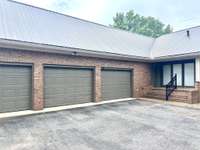 Massive 3 car attached garage  in the back with extra storage as well as walk up attic space.