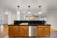 Open conept floor plan!  At the sink you have the dining and foyer to the left/ living room looking ahead, large eat in kitchen, and sunroom overlooking the pool to your right.