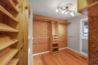 Primary bedroom walk in closet