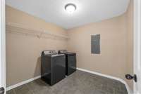 Large laundry room.  Washer and Dryer remain, but they are used and don't come with a warranty. Tile flooring