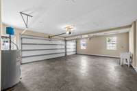 3 car garage. new garage door openers installed. Utility sink. Wired for 240V