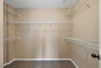Primary bedroom walk in closet