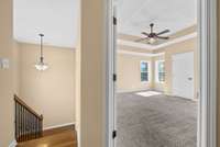 Once you come up the stairs there is a large bedroom on the left with tray ceiling.  This room has a closet, so it can be a 4th bedroom or a large bonus room