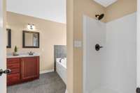 primary bathroom has a separate shower, jacuzzi tub and separate toilet room