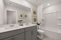 Upstairs secondary bathroom has dual sinks