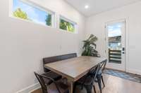 Behind the dining room table is the back door where you have your own ample parking