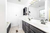 Master bathroom with separate tub and shower