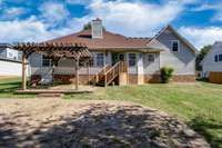 Backyard area with pavers and pergola