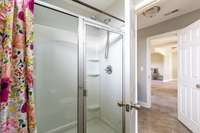 Large walk in shower, separate from the vanity area.