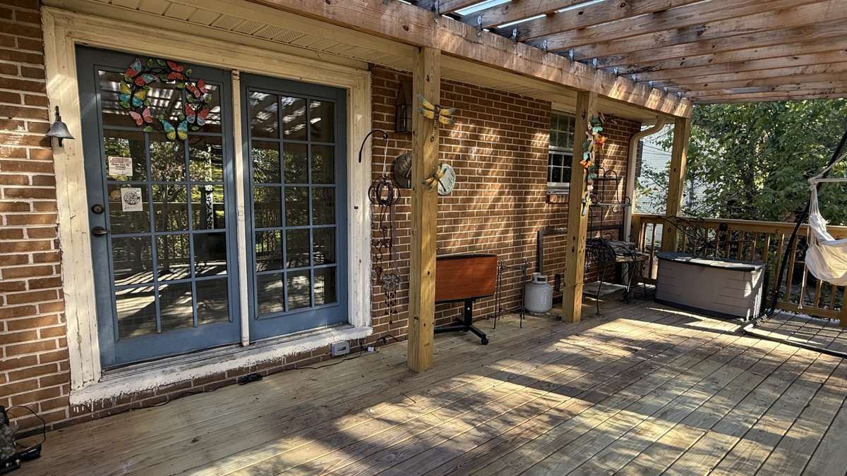 View of the Top Covered Deck and Entrance to the the Dinning and Kitchen