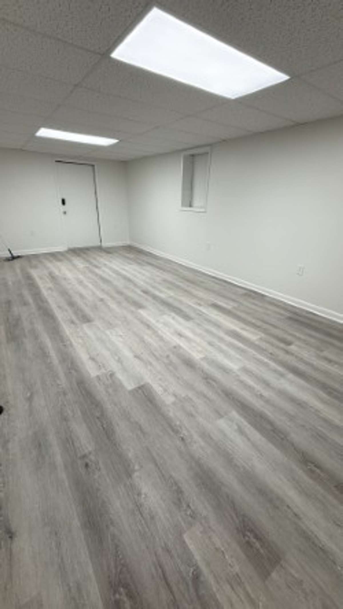 Den in downstairs with entrance to the Garage