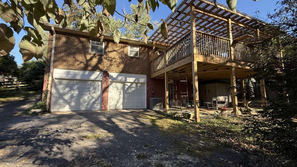 Back of Home with 2 Car Garage, with Large 16x25 Covered Patio and Covered Deck