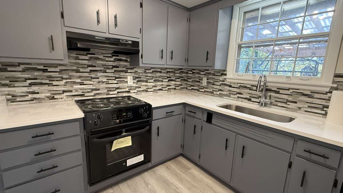 Kitchen with Granite Counter, Undermount Sink and New Flooring.