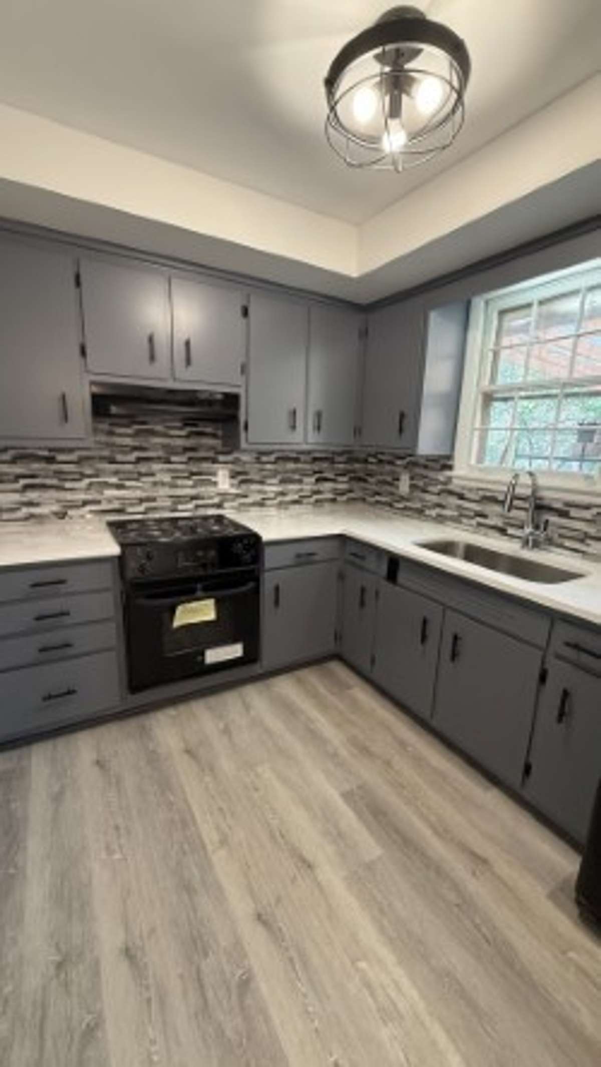 Kitchen with lots of Cainets and Granite Counter Top
