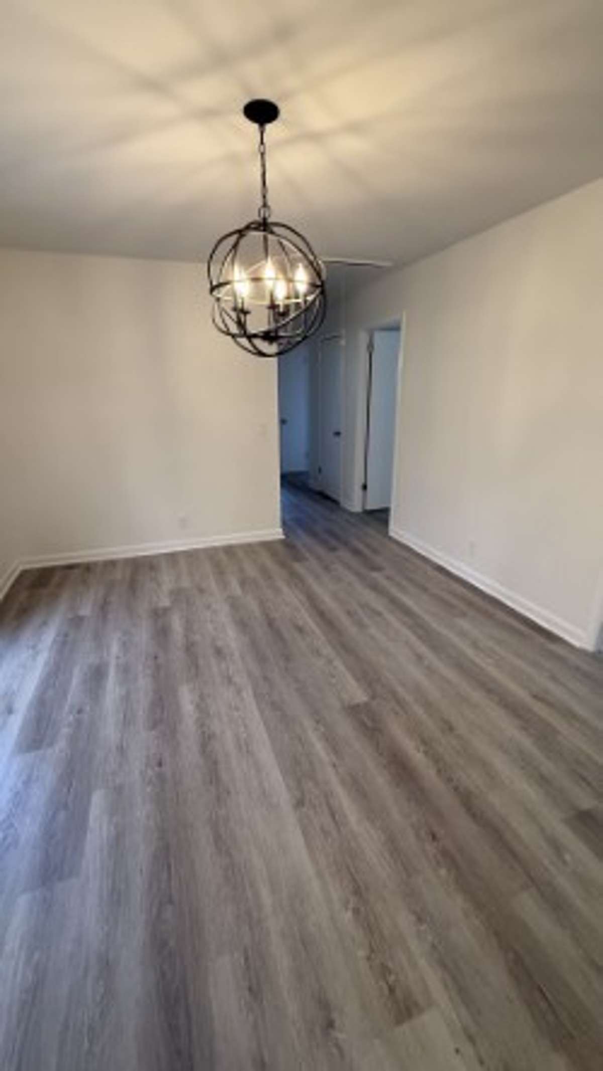 Dinning Room with Beautiful Hanging Light Fixture