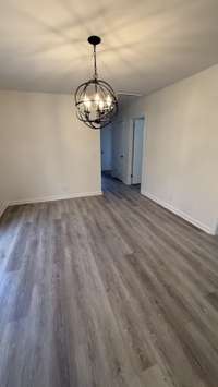 Dinning Room with Beautiful Hanging Light Fixture