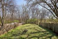Large back yard that has plenty of room to plant a garden and enjoy a fire on  cool nights. Fenced in private yard.