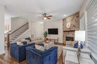 Slat stone around fireplace, Iron spindles in stairway