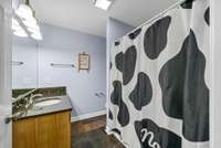 Full bath upstairs with tiled floors.