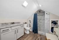 One of the full baths in the apartment bedroom with a shower.
