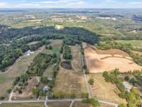 The 20.42 acres is a long rectangle shape, and the house sits far off the road. There is a pond located in the field for either cows, horses, llamas, or emus, or just have a large front yard that you can bale hay.