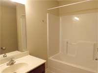 Main bath on second floor has a tub/shower combo.