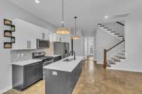 Updated kitchen with breakfast nook and open floorplan that flows into the living room.