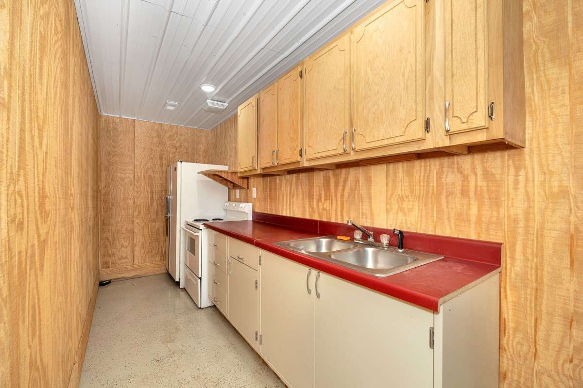Kitchen- concrete flooring, recessed lighting