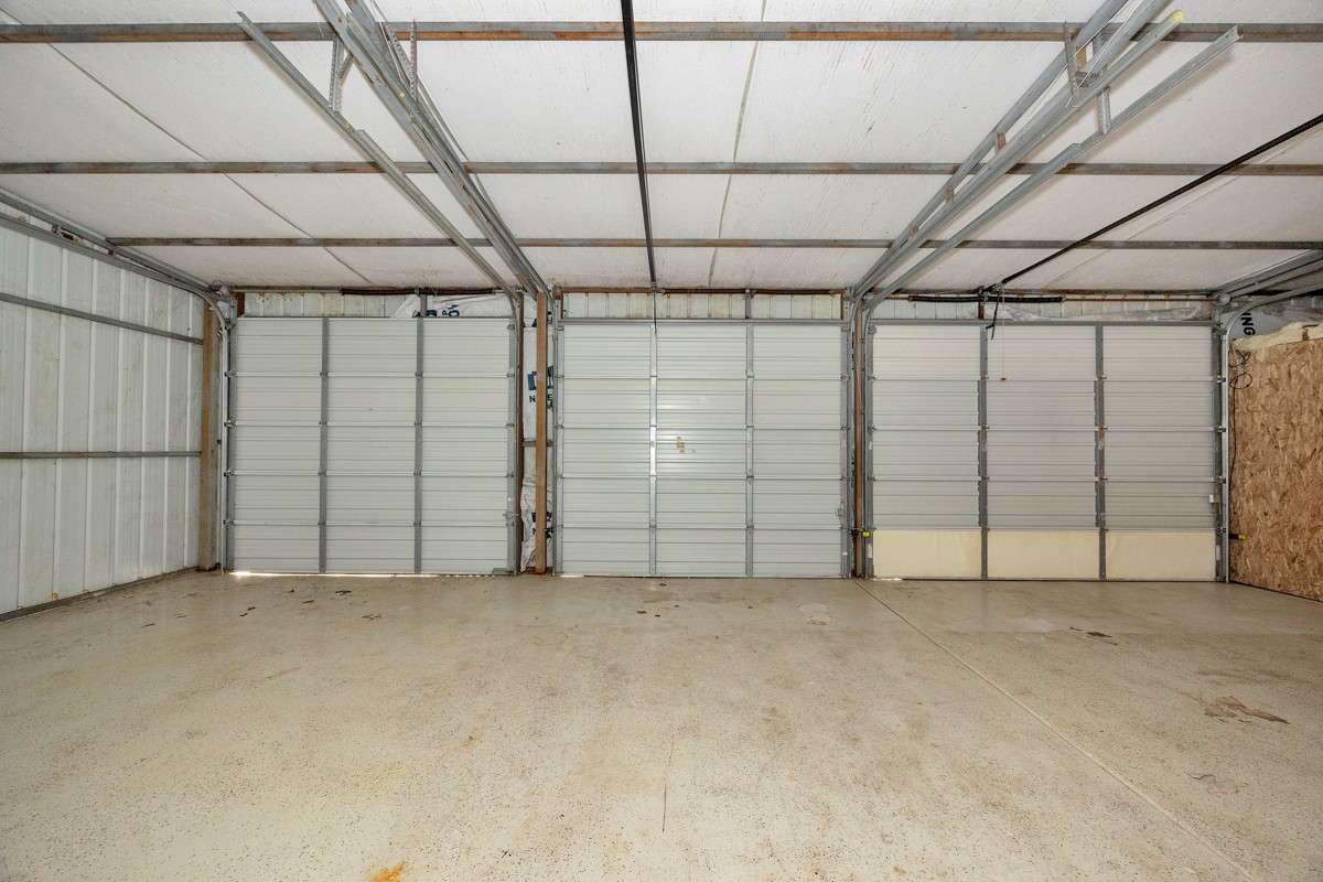 Three-car Garage with three roll-up doors