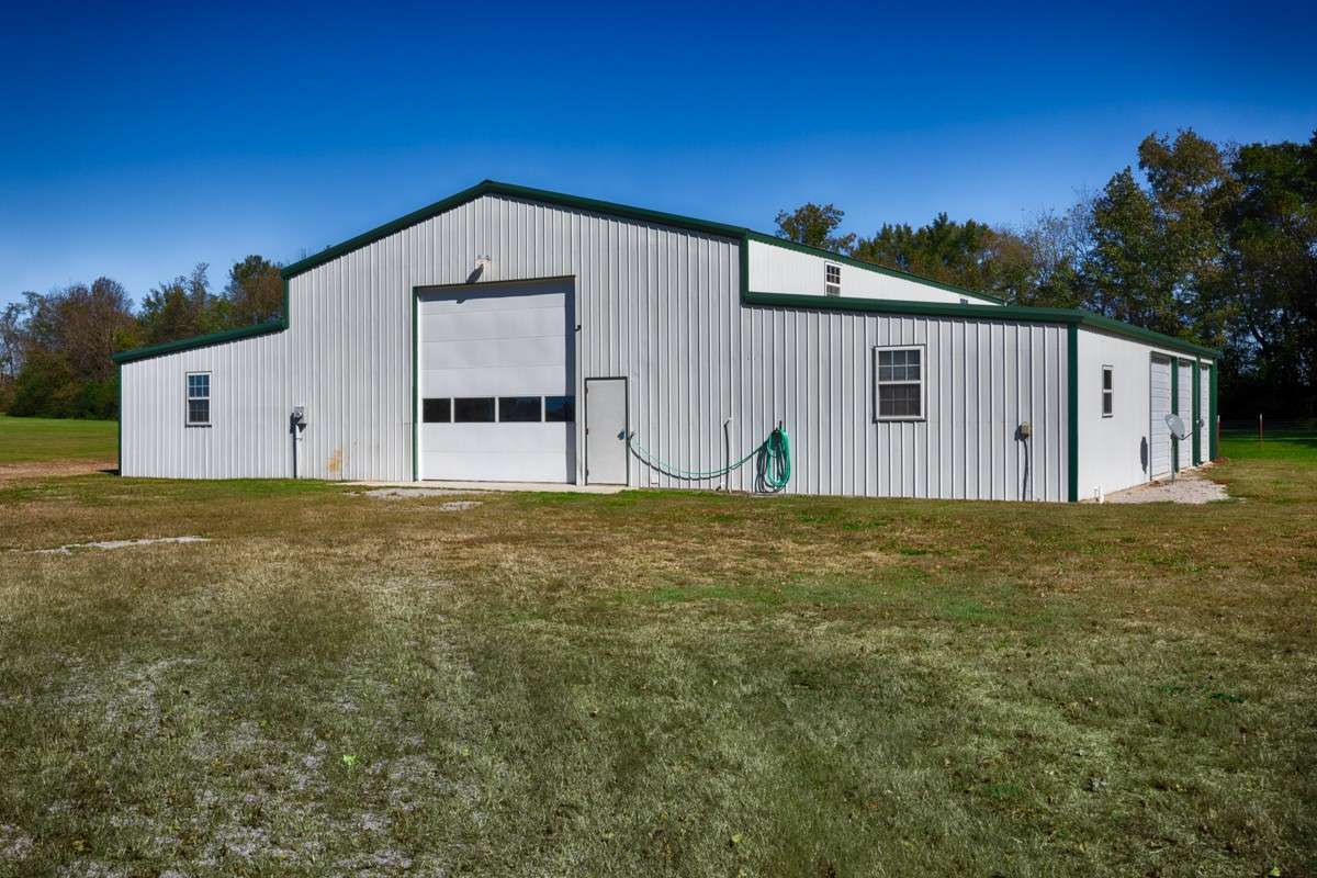 Back of building- Single 14x14 overhead door, concrete pad, and pedestrian door
