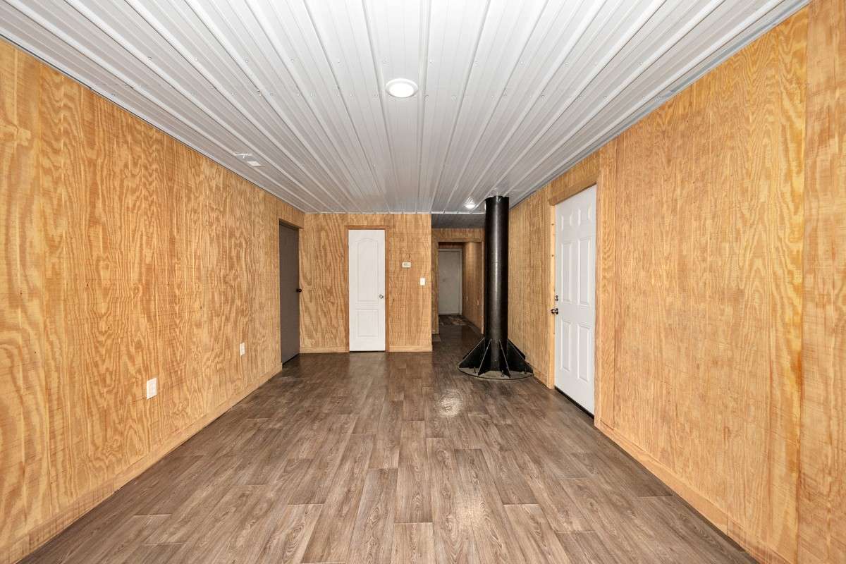 Great room- vinyl flooring, recessed lighting