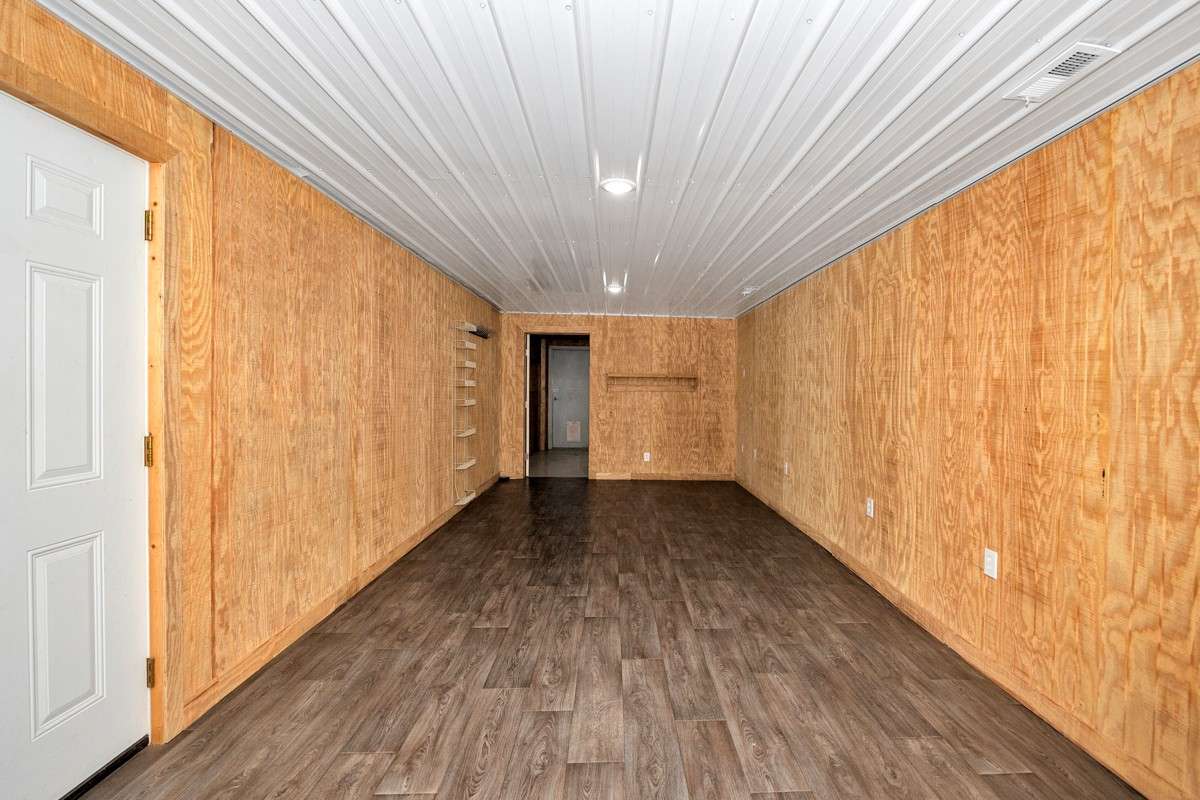 Great room- vinyl flooring, recessed lighting