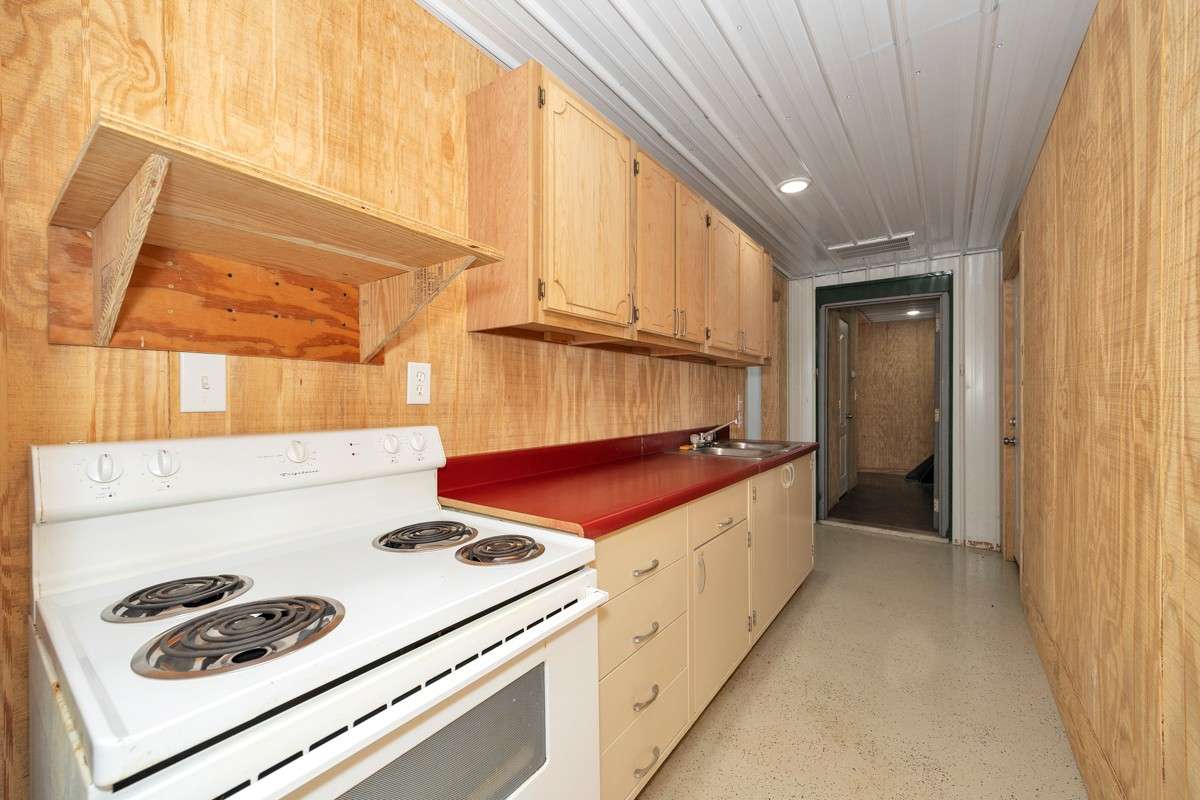 Kitchen- concrete flooring, recessed lighting