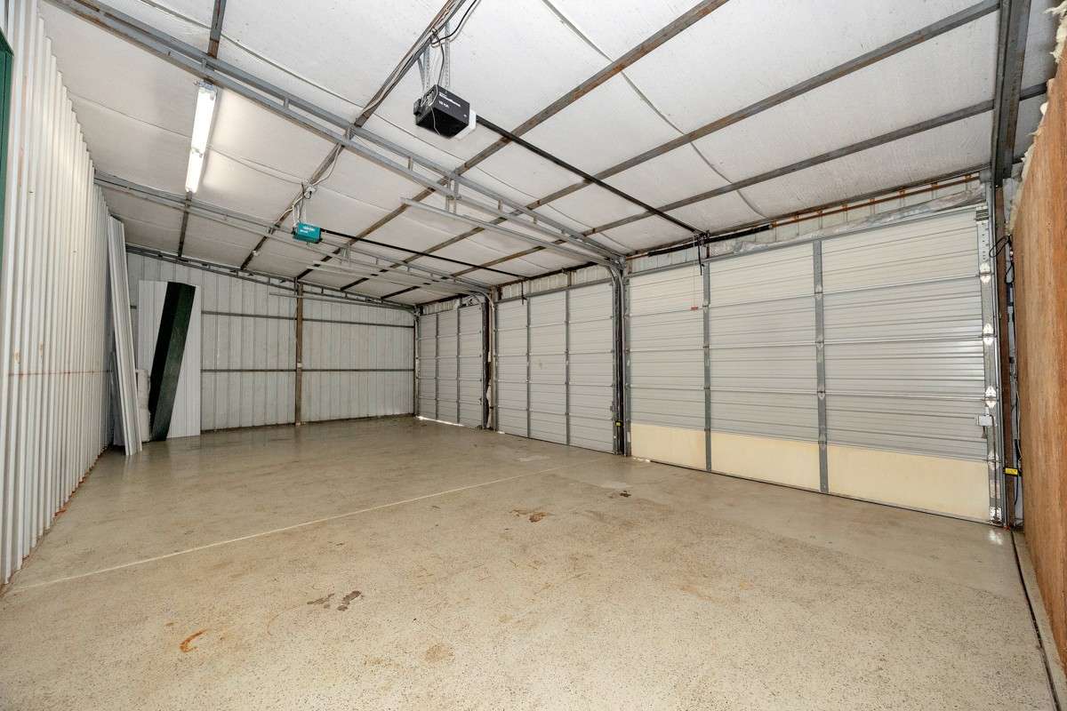 Three-car Garage with three roll-up doors
