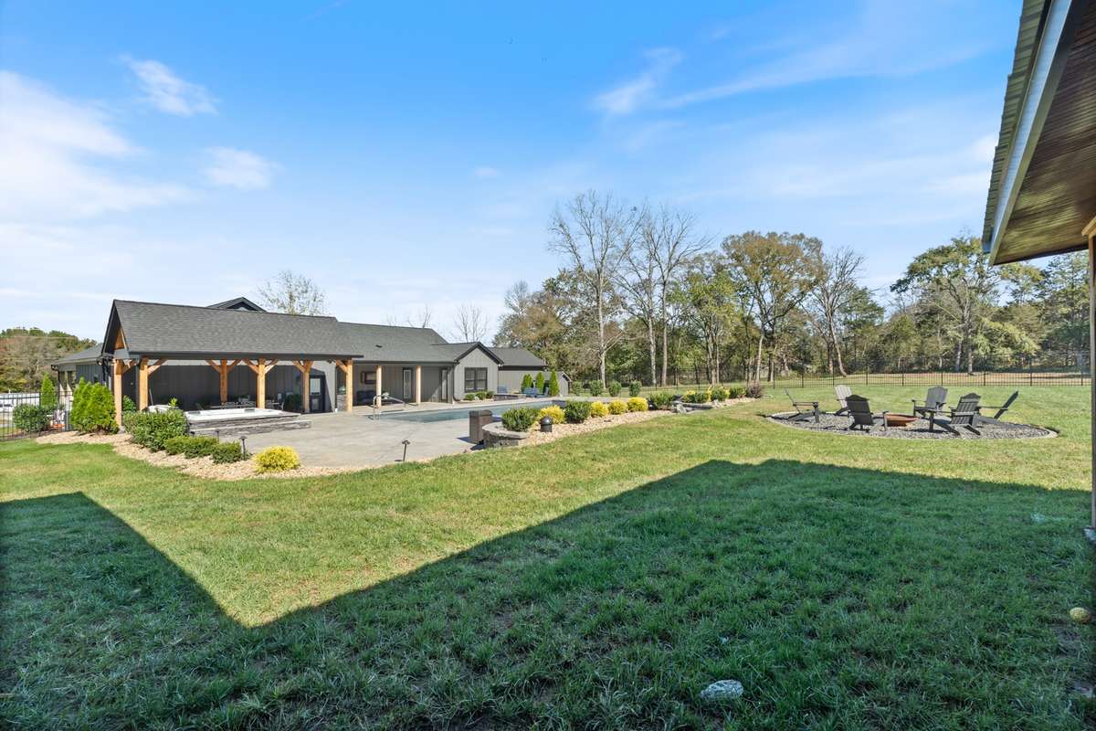 From the barn you can access the fenced backyard which is great for entertaining and enjoying the entire outdoor experience.