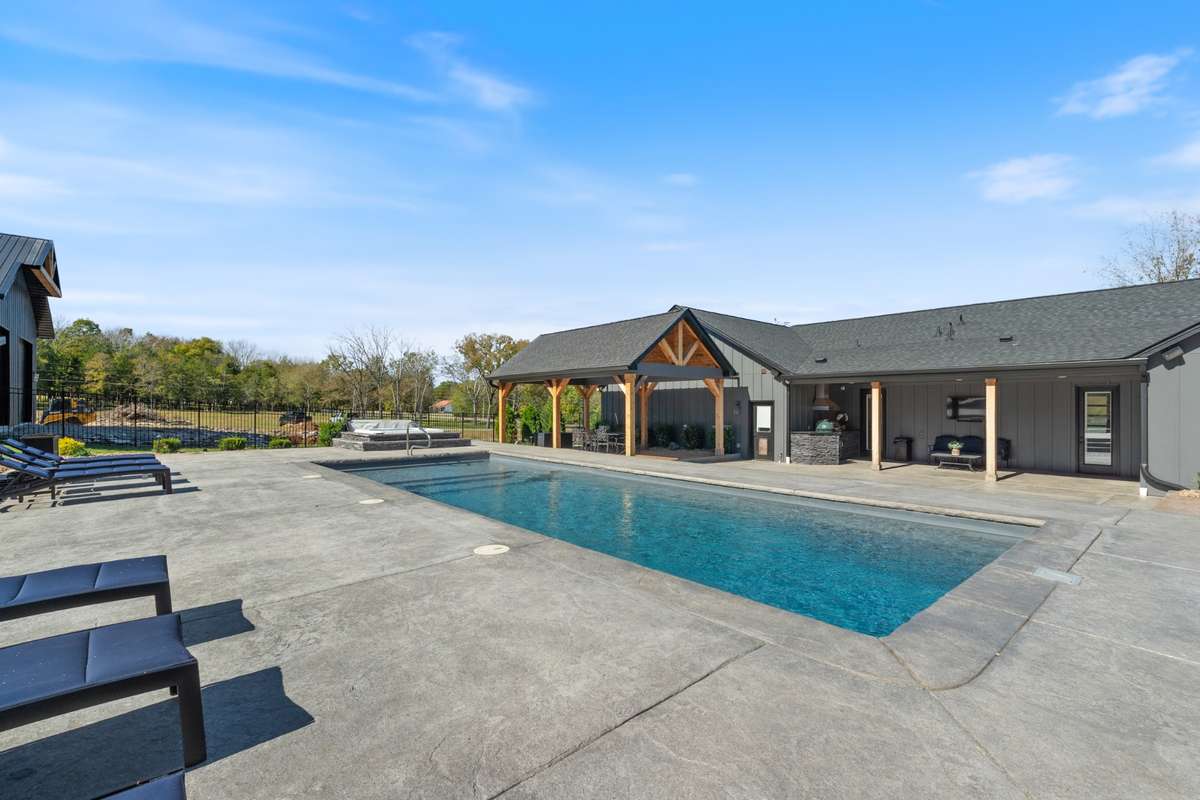 Plenty of room around the pool on this stamped concrete pool decking.