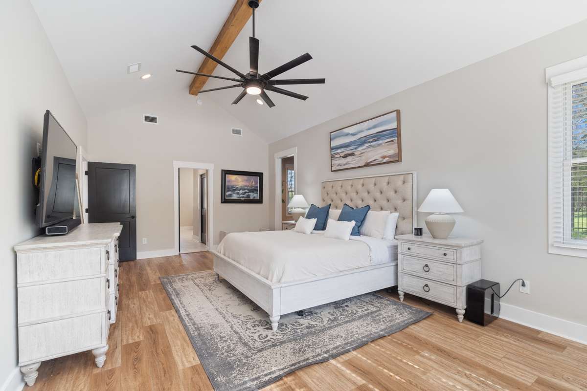 Vaulted ceilings, recess lights, wood beam and custom ceiling fan accentuate the space for comfort and style.