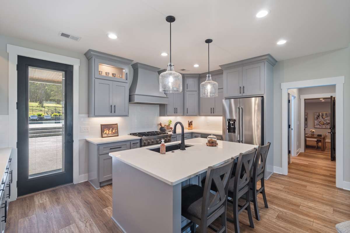 Direct access to the outdoor living area—perfect for indoor-outdoor gatherings around the outdoor kitchen and outdoor covered dining area.