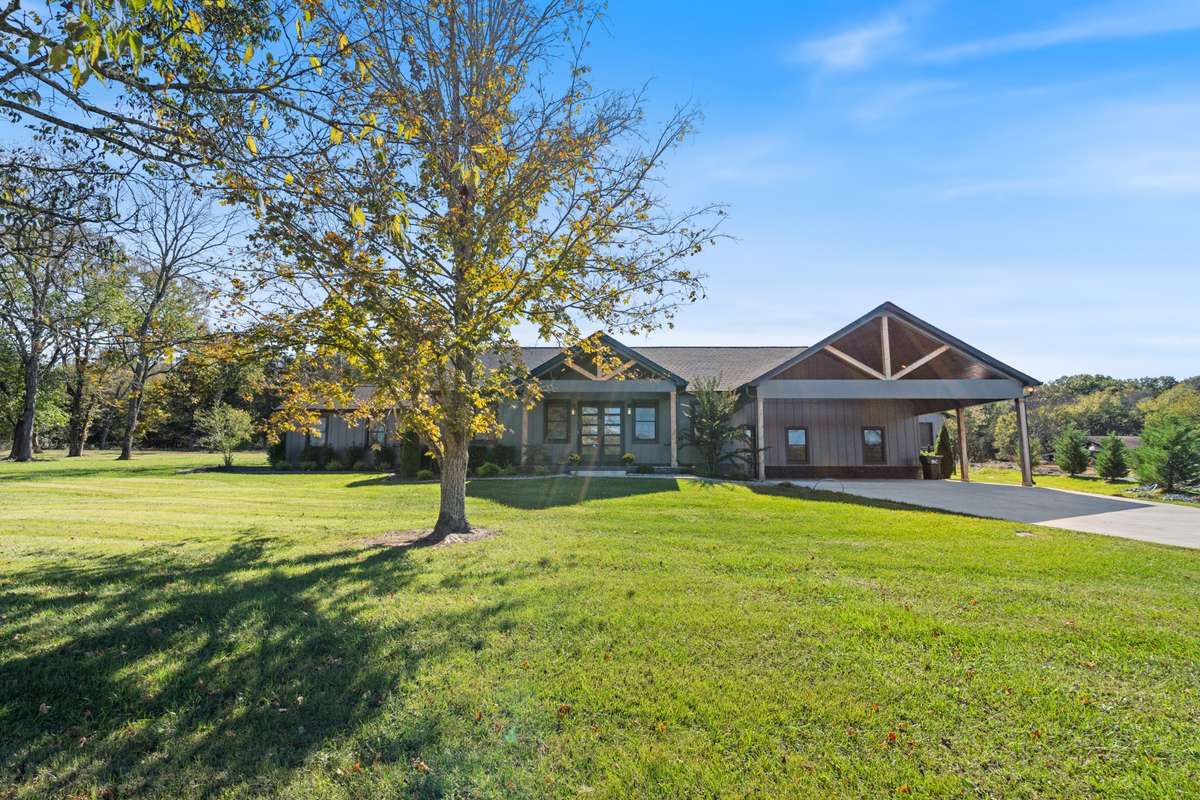 Custom designed Craftsman home, offers a modern feel, warm wood accents, clean lines and an inviting entry to this one of a kind home on 10 acres.