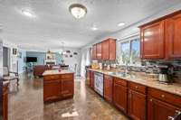 Eat in Kitchen Open to Family Room with Fireplace