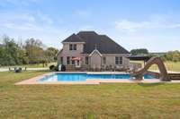 The inground pool was installed in 2020. There is a small "sunning ledge" and a large stone "tanning deck" for your enjoyment...along with a slide the kiddos are sure to love!