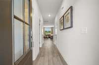 Entry foyer with luxury vinyl plank flooring.