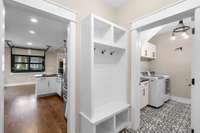 Coming in from the garage, you will be pleased to see this drop zone area; perfect for keeping everything organized and ready! Note the size of the laundry room seen here!