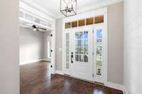 What a great view of the beautiful 9-light front door, side lites and transom window...so pretty!