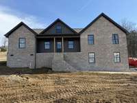 475 Bridle Path Lane Hartsville TN Lot 61 
This home is under construction featuring brick and hardy board exterior, black aluminum finishes, with side entry garage.