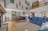 Open-concept living room flows seamlessly into the kitchen, offering plenty of seating—an ideal setup for entertaining family and friends.