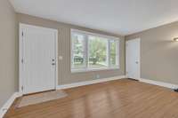Large window in living room allows for a lot of light.