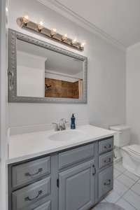 Full bath on the main level.  Cabinet has a fresh coat of paint, and the tub/shower combo has been totally renovated.