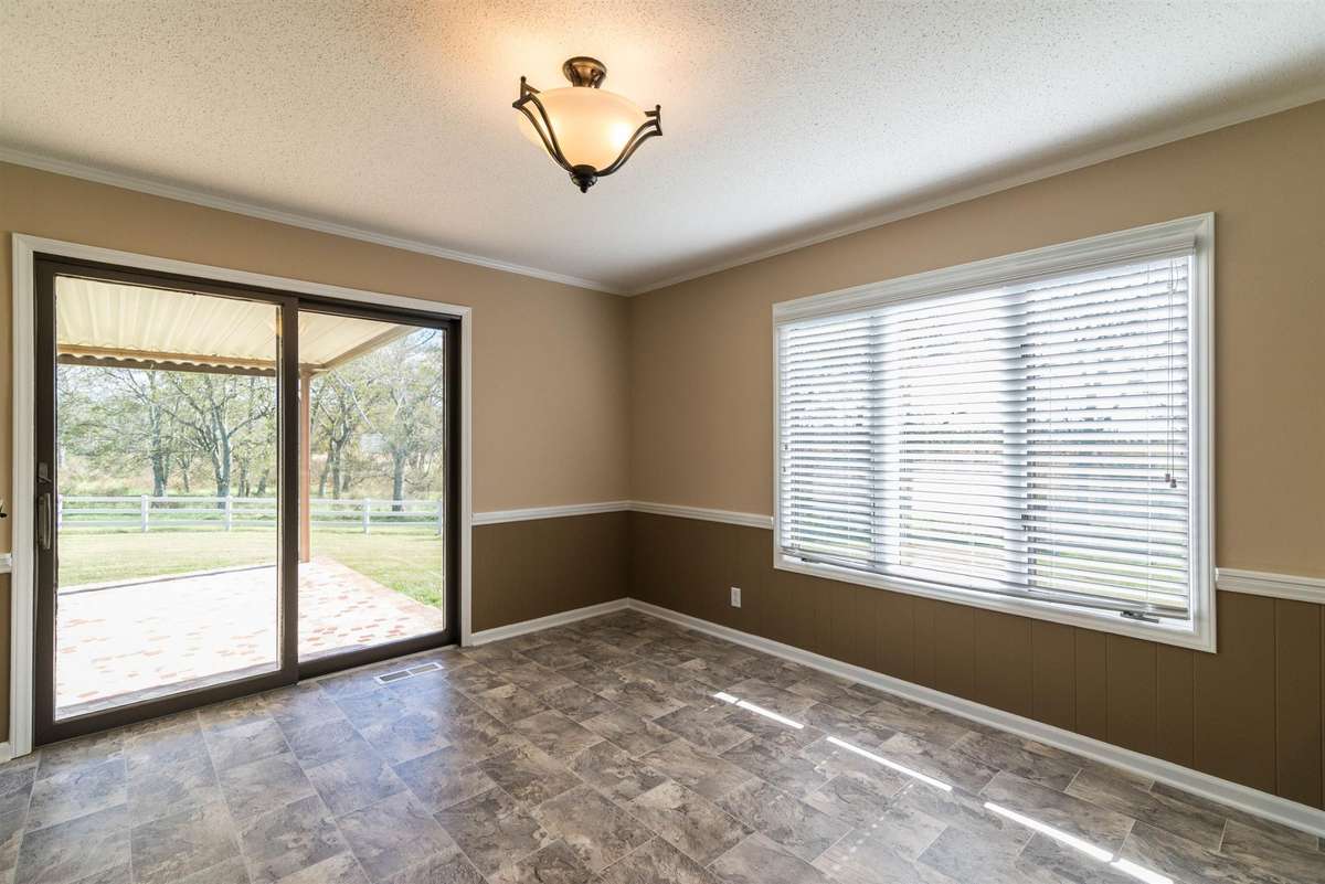 Main Home Dining Room that leads to Back Covered Patio