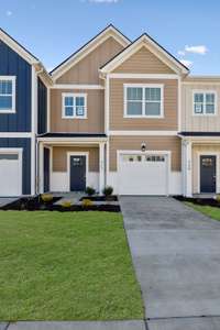 327 Carver Connection - our CLARA Floor Plan. Featuring beautiful Khaki Brown Hardie Body with White Trim.